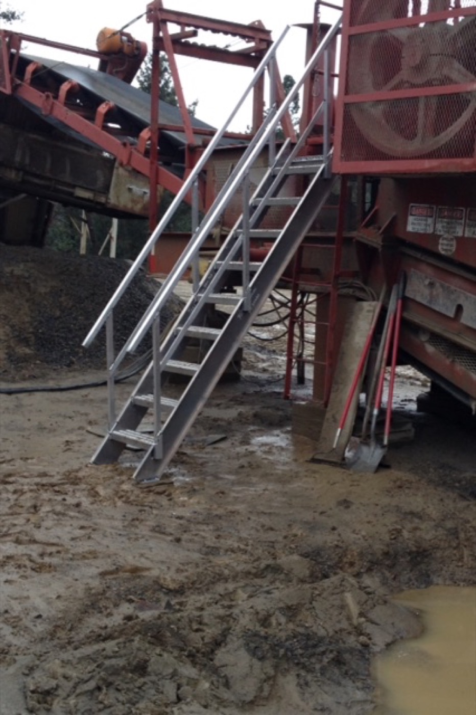 Welded aluminum access stairs with railings built for a piece of equipment