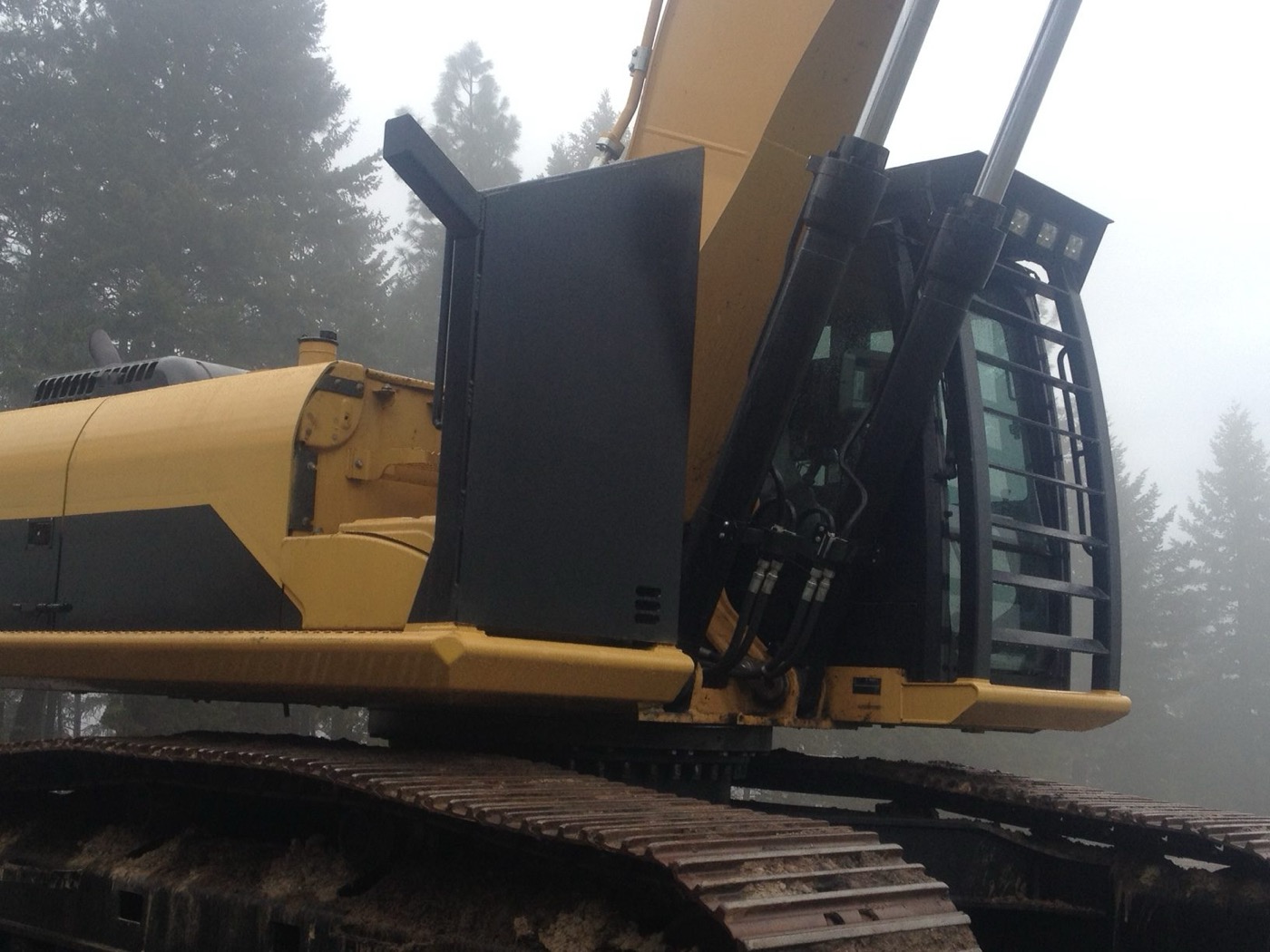 CAT 329 excavator fitted with a new catwalk and cab guarding in the shop